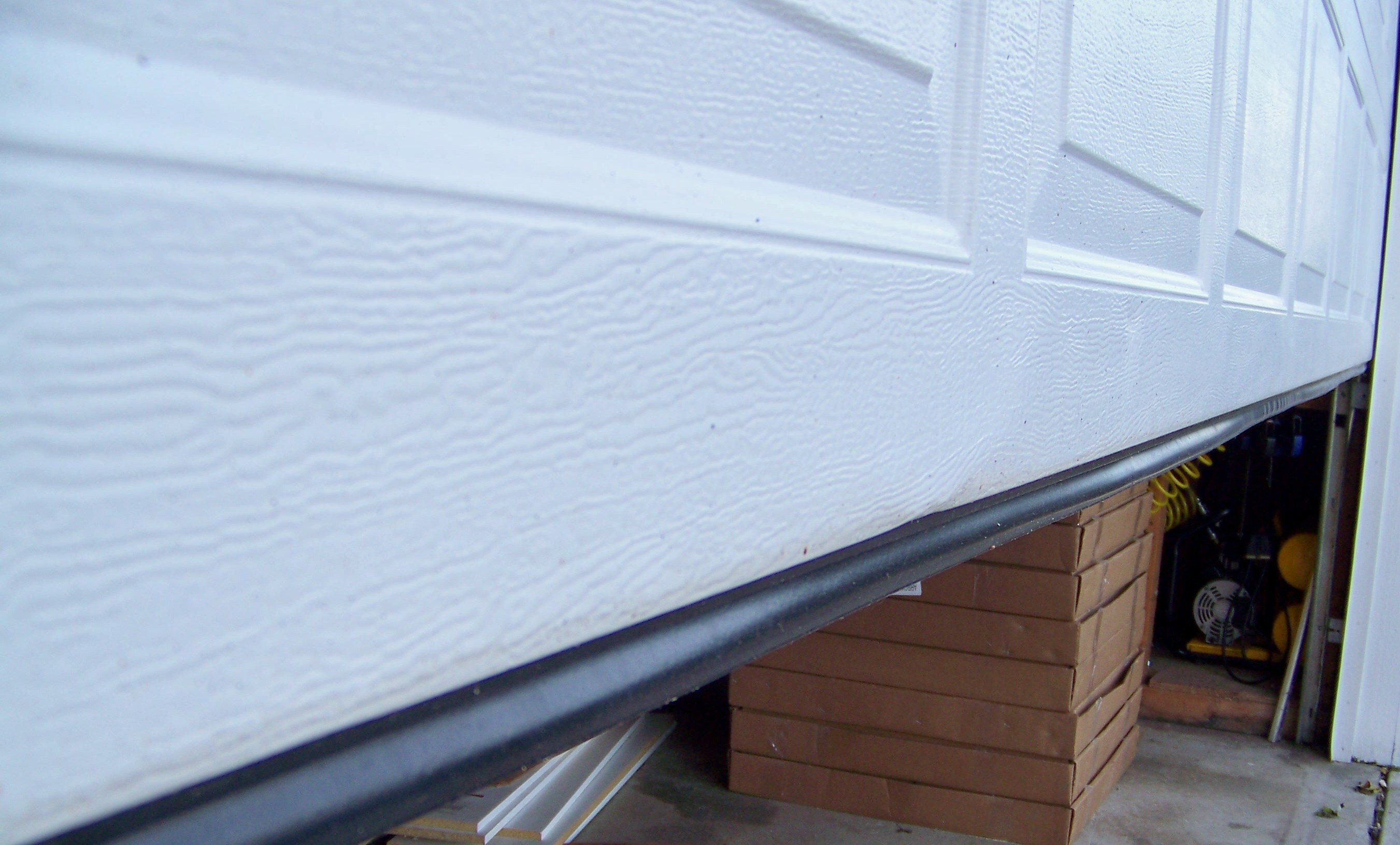Garage Door Floor Weather Stripping, How To Install Weather Seal On Garage Door